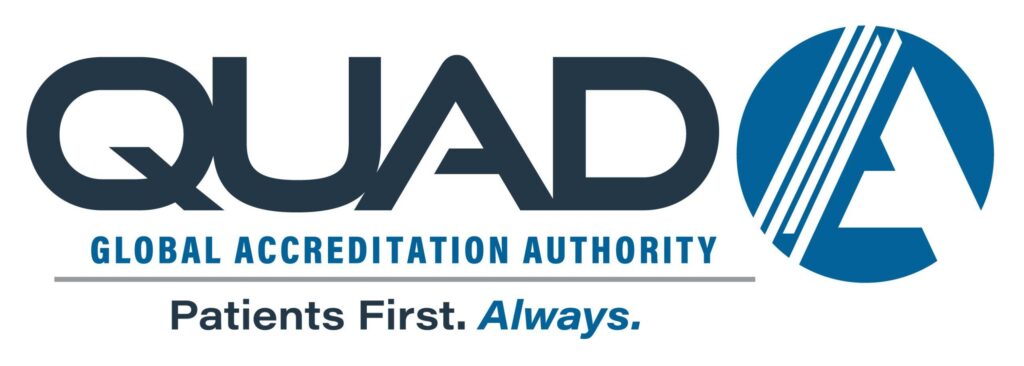Logo for QUAD A Global Accreditation Authority, featuring bold text, a stylized “A” in a blue circle, and the tagline “Patients First. Always.”.
