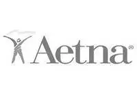 A grayscale Aetna logo with stylized human figure on the left, arms raised, next to the word Aetna in a large serif font.